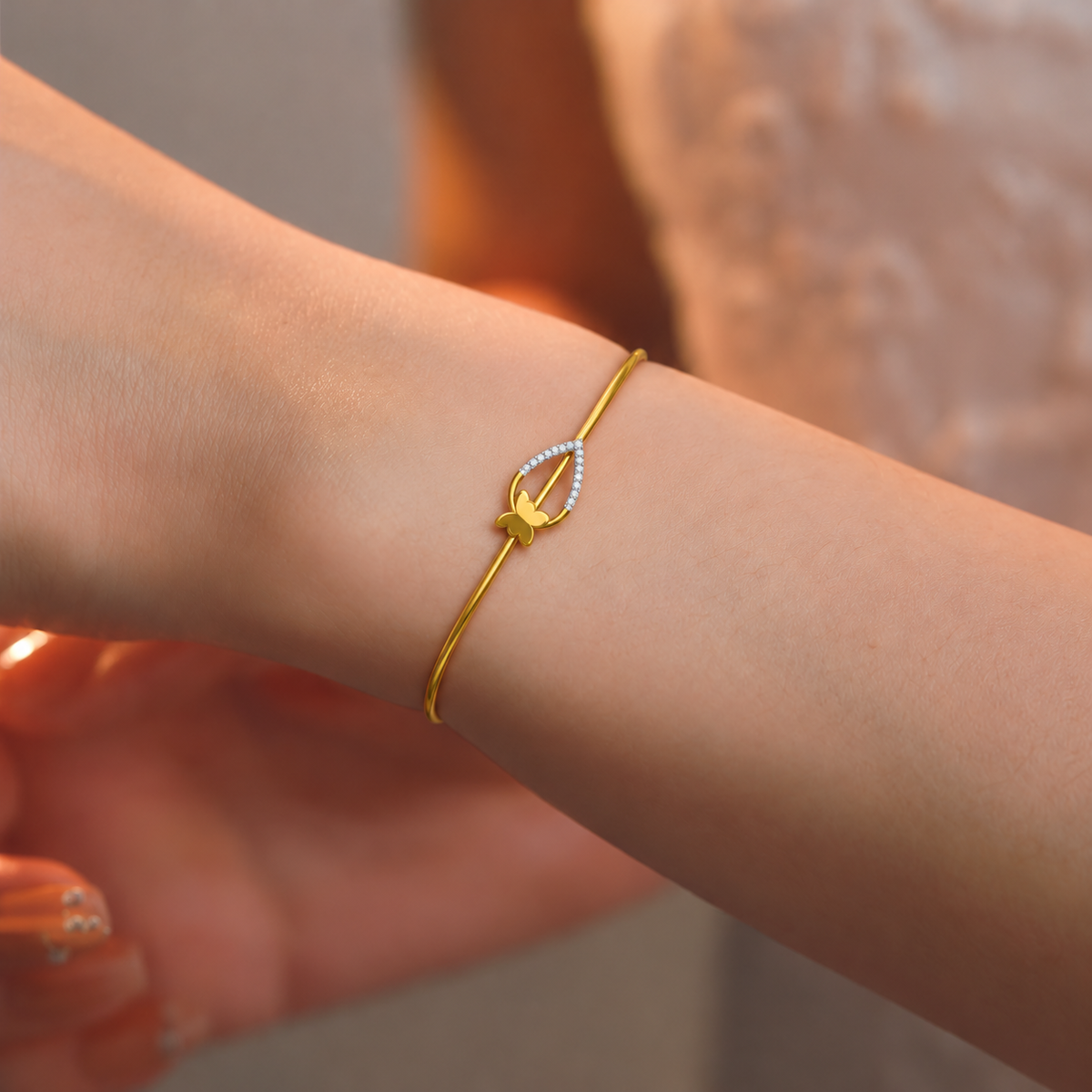 Butterfly Teardrop Diamond Gold Bangle - worn view 1